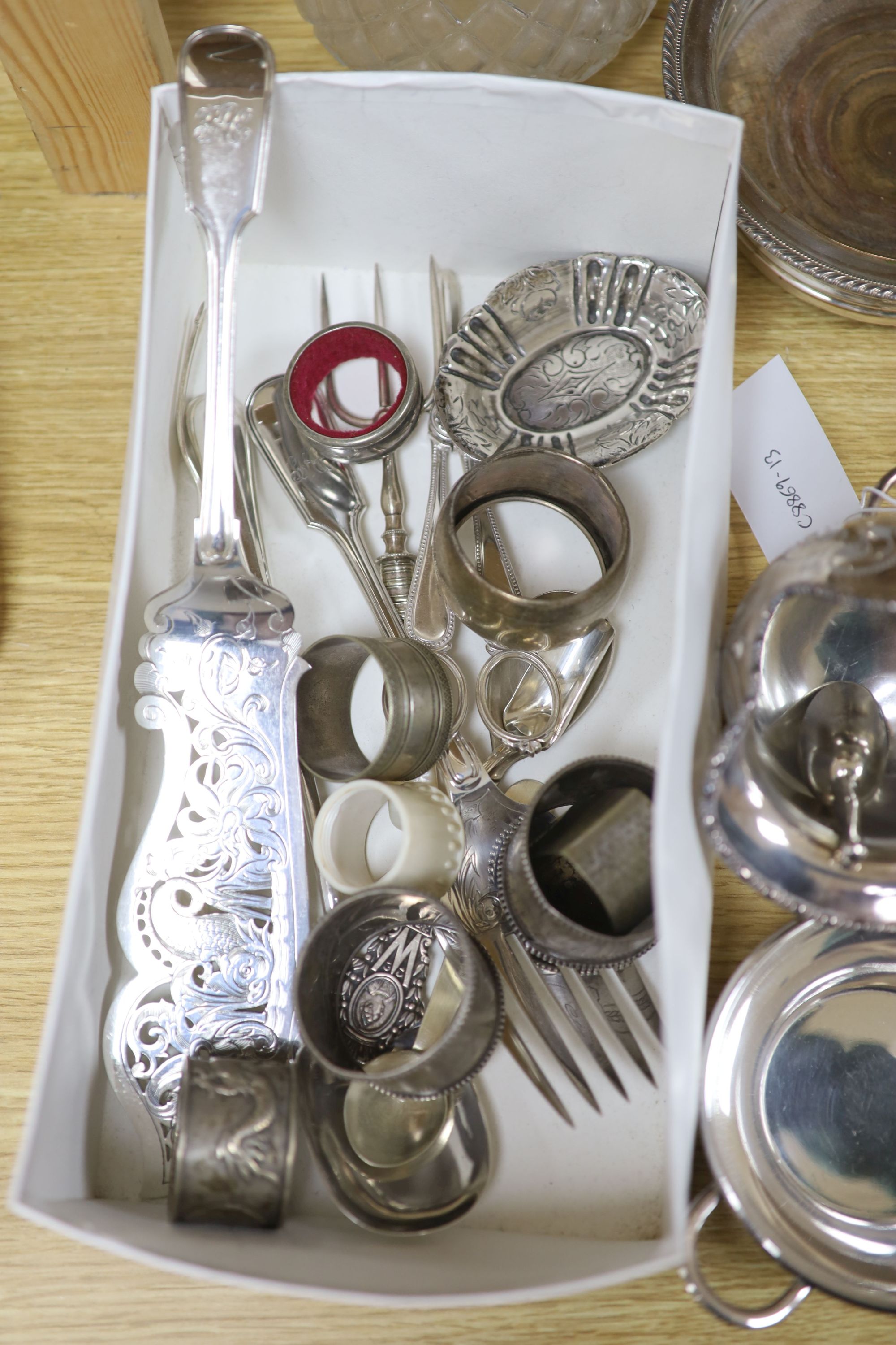 A group of mixed plated wares including a pair of wine coasters, 15.5cm, napkin rings, flatware, etc.